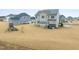 Expansive backyard featuring a deck, lawn, and exterior view of a two-story home at 254 Dungannon, Clayton, NC 27520