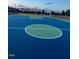 Community basketball court with bright blue and green surfaces, ready for play at 254 Dungannon, Clayton, NC 27520