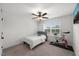 Bright bedroom with ceiling fan, window, and exercise bike for fitness enthusiasts at 254 Dungannon, Clayton, NC 27520