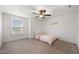Bright bedroom features a ceiling fan and a window with blinds, creating a comfortable space at 254 Dungannon, Clayton, NC 27520