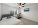 Comfortable bedroom includes a TV, ceiling fan, window, and exercise bike at 254 Dungannon, Clayton, NC 27520