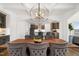 Dining room featuring a large wooden table, pendant lighting, and an open view into the kitchen at 254 Dungannon, Clayton, NC 27520