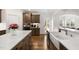 Bright kitchen with white countertops, custom cabinets, and a farmhouse sink at 254 Dungannon, Clayton, NC 27520