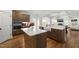 Kitchen island with white countertop and a view into the Living Room at 254 Dungannon, Clayton, NC 27520