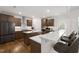 Modern kitchen featuring custom cabinets, stainless steel appliances, and a breakfast bar at 254 Dungannon, Clayton, NC 27520