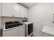 Laundry room features modern appliances and ample counter space, perfect for household tasks at 254 Dungannon, Clayton, NC 27520