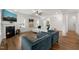 Inviting living room with a fireplace, plush seating, hardwood floors, and an open design at 254 Dungannon, Clayton, NC 27520