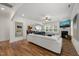 Spacious living room showcasing hardwood floors, white sofa, fireplace, and open layout at 254 Dungannon, Clayton, NC 27520
