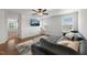 Well-lit living room with a large gray sectional sofa, TV, and area rug on hardwood floors at 254 Dungannon, Clayton, NC 27520