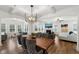 Spacious open-concept living and dining room with hardwood floors and fireplace at 254 Dungannon, Clayton, NC 27520