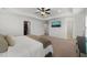 Bright main bedroom with walk-in closet, tray ceilings, and a TV at 254 Dungannon, Clayton, NC 27520