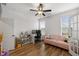 Spacious office with a pink sofa, toys, and bright windows at 254 Dungannon, Clayton, NC 27520