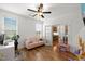 Bright office with lots of windows and a comfortable pink sofa for relaxing at 254 Dungannon, Clayton, NC 27520