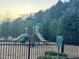 Community playground with climbing structure and slides, fenced for safety at 254 Dungannon, Clayton, NC 27520