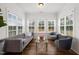 Bright sunroom filled with natural light and stylish furnishings at 254 Dungannon, Clayton, NC 27520