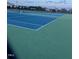 Community tennis courts featuring new-looking vibrant blue and green surfaces at 254 Dungannon, Clayton, NC 27520