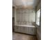 Unfinished kitchen features new gray cabinets, quartz countertops, and trimwork around a bright window at 3302 Hall Pl, Raleigh, NC 27607