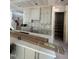 Spacious unfinished kitchen with new gray cabinets and quartz countertops with an island at 3302 Hall Pl, Raleigh, NC 27607