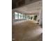Spacious living room with large windows offering abundant natural light and a sliding glass door to a deck at 3302 Hall Pl, Raleigh, NC 27607