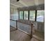 New staircase with wooden handrail, and white balusters illuminated by natural light from nearby windows at 3302 Hall Pl, Raleigh, NC 27607