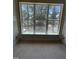 Large window with wood trim lets in natural light and offers neighborhood views at 3302 Hall Pl, Raleigh, NC 27607