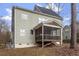 The back exterior featuring a screened porch, offering a relaxing space to enjoy the outdoors at 4324 Brighton Ridge Dr, Apex, NC 27539