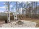 Backyard with stone fire pit and pergola, perfect for outdoor gatherings at 4324 Brighton Ridge Dr, Apex, NC 27539