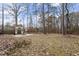 A spacious backyard featuring a fire pit and pergola, perfect for outdoor gatherings and relaxation at 4324 Brighton Ridge Dr, Apex, NC 27539