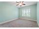 This bedroom has soft carpet, fresh paint and a large bright window overlooking a treed exterior at 4324 Brighton Ridge Dr, Apex, NC 27539