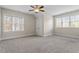 Large bedroom features dual windows, plush carpet, and a ceiling fan for ultimate comfort at 4324 Brighton Ridge Dr, Apex, NC 27539
