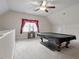 Expansive bonus room with plush carpeting and a pool table, perfect for entertaining at 4324 Brighton Ridge Dr, Apex, NC 27539
