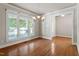 Elegant dining room with hardwood floors, large windows, and chandelier at 4324 Brighton Ridge Dr, Apex, NC 27539