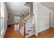 Welcoming entryway with hardwood floors, staircase, and views into the spacious living areas at 4324 Brighton Ridge Dr, Apex, NC 27539