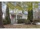 Charming two-story home featuring a covered front porch, stone steps, and a manicured front yard with mature trees at 4324 Brighton Ridge Dr, Apex, NC 27539