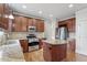 Modern kitchen featuring stainless steel appliances, granite countertops, and hardwood floors at 4324 Brighton Ridge Dr, Apex, NC 27539