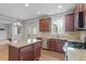 Bright kitchen with wood cabinets, granite countertops, and stainless steel appliances at 4324 Brighton Ridge Dr, Apex, NC 27539