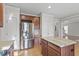 Spacious kitchen featuring stainless steel appliances and a large central island at 4324 Brighton Ridge Dr, Apex, NC 27539