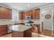 Well-lit kitchen with stainless steel appliances, granite countertops, and hardwood floors at 4324 Brighton Ridge Dr, Apex, NC 27539
