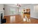 Open-concept living room with hardwood floors, fireplace, and seamless access to the kitchen at 4324 Brighton Ridge Dr, Apex, NC 27539