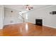 Spacious living room features a cozy fireplace, hardwood flooring, and staircase to the upper level at 4324 Brighton Ridge Dr, Apex, NC 27539
