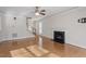 Cozy living room with a classic fireplace and gleaming hardwood floors at 4324 Brighton Ridge Dr, Apex, NC 27539