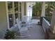 Relaxing front porch with white rocking chairs and classic outdoor furniture at 4324 Brighton Ridge Dr, Apex, NC 27539