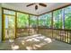 Screened-in porch with wood flooring and natural views of the surrounding trees at 4324 Brighton Ridge Dr, Apex, NC 27539