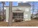View of the back exterior of the home with a screened porch, perfect for relaxing outdoors at 4324 Brighton Ridge Dr, Apex, NC 27539
