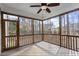 Inviting screened porch with wood flooring, fan, and scenic outdoor views at 4324 Brighton Ridge Dr, Apex, NC 27539
