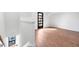 Bedroom with hardwood floors, a modern door, and a view from the stairs and landing at 512 Gordon Street # 602, Durham, NC 27701
