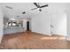 Open-concept space with hardwood floors, light-filled windows, modern lighting and kitchen area at 512 Gordon Street # 602, Durham, NC 27701