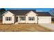 Newly built single-story house with neutral siding and a two-car garage at 52 Roll Tide Ct, Angier, NC 27501