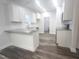 Modern kitchen with granite countertops, white cabinets, and an island at 52 Roll Tide Ct, Angier, NC 27501