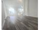 Spacious living room with hardwood floors and large windows at 52 Roll Tide Ct, Angier, NC 27501